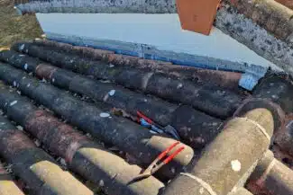 Chapeau de ventilation posé près du faîtage à Pibrac